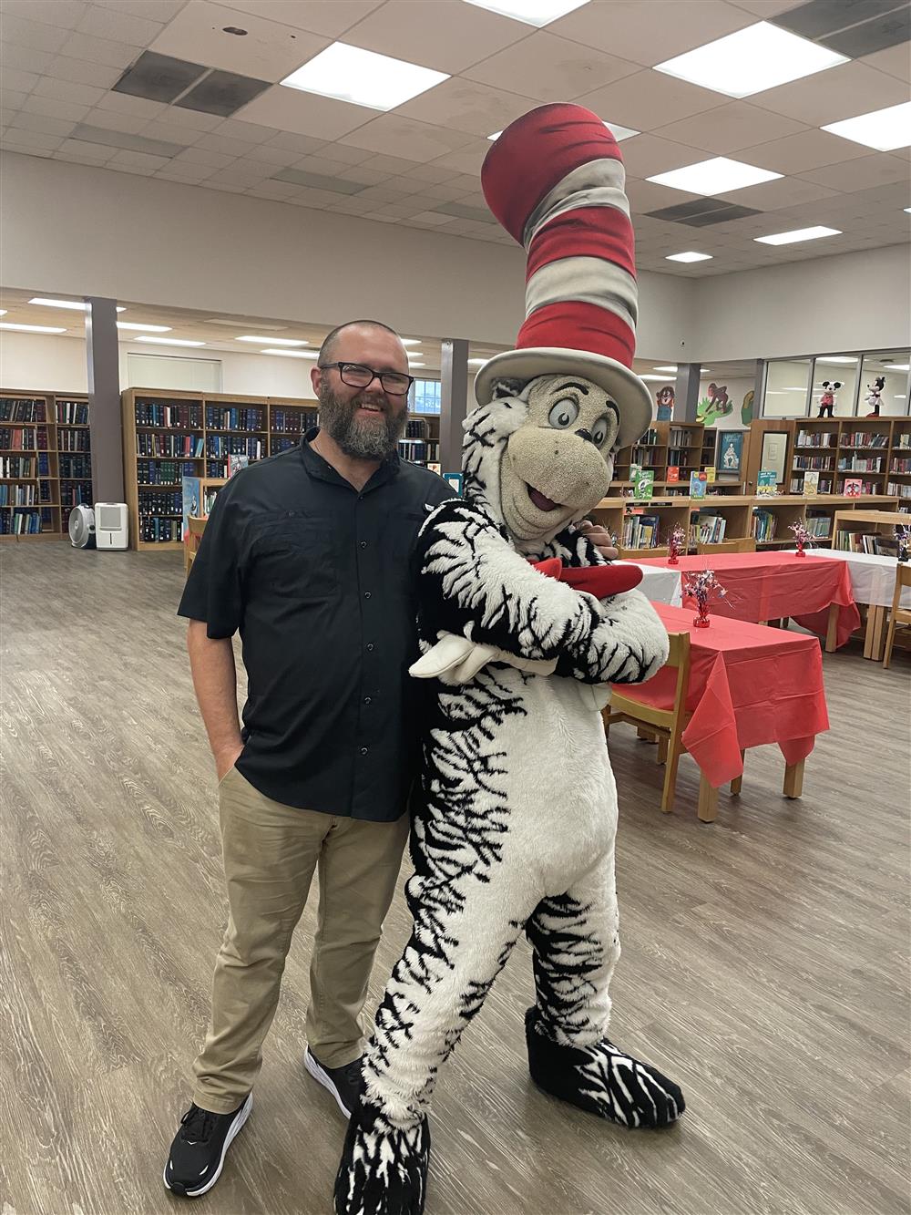 Sub-regional library reader adviser Ben Payne, chilling with the Cat during this photo. 